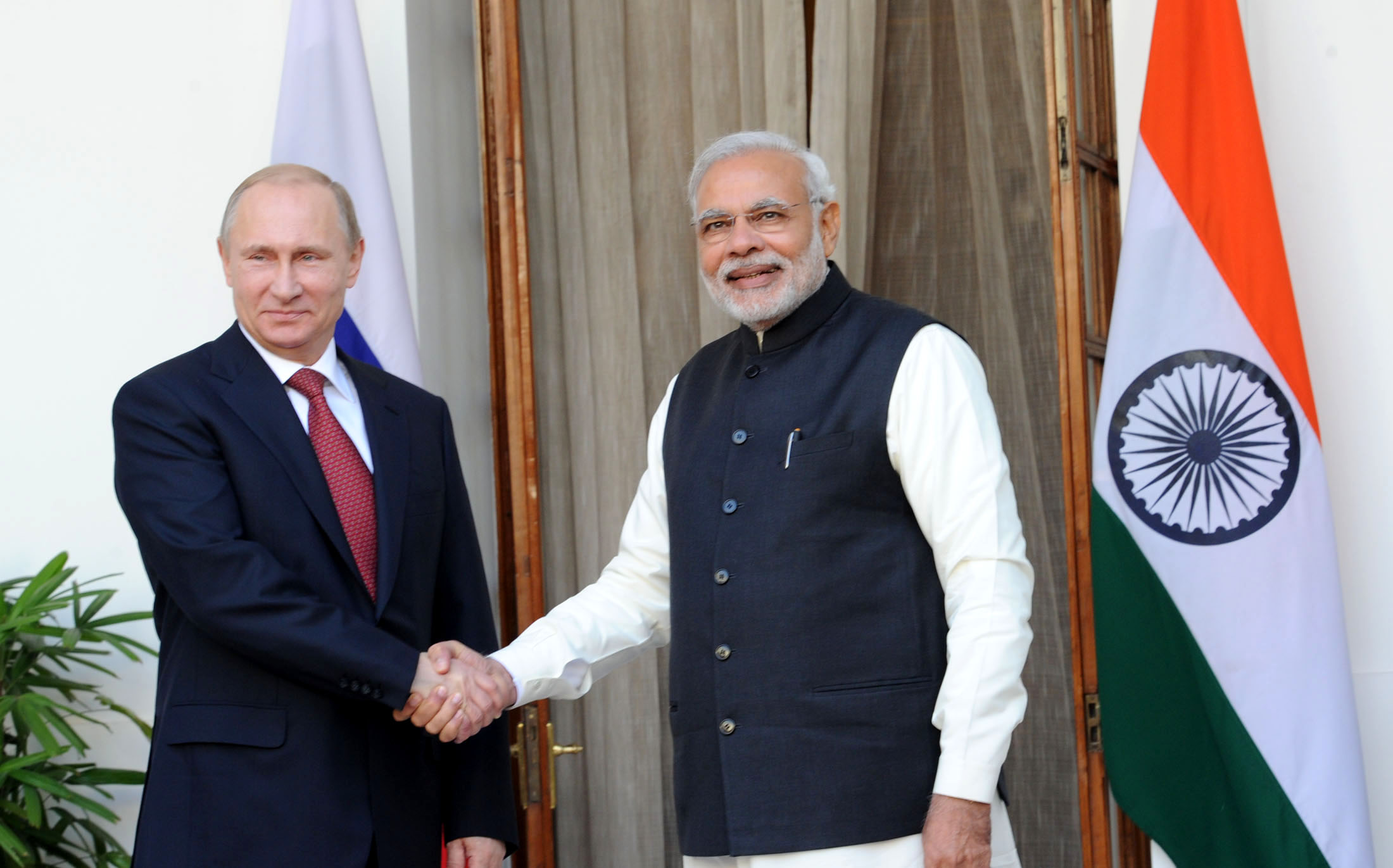 Vladimir Putin and Narendra Modi greet each other at the 15th Annual India Russia Summit
